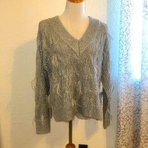 Like new feather trimmed sweater